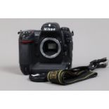 A Nikon D2H DSLR Camera body, serial no 2033910, body G, light wear, with body cap, strap, battery