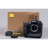 A Nikon D2x DSLR Camera Body, serial no 5067870, body G, light wear, with body cap, display screen