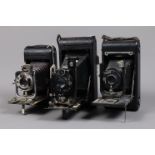 Three Folding Cameras, a Goerz Tenax Postcard, shutter working, body G, bellows G, elements F-G,