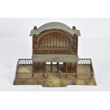 An Issmayer 0 Gauge 'Grand Station', with high-arched lithographed windows to each side, 3 arched