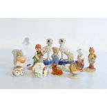 A collection of miscellaneous porcelain figurines, including three Royal Crown Derby animal