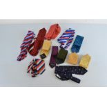 A large quantity of gentleman's silk ties, dress ties, buttons, cravats etc