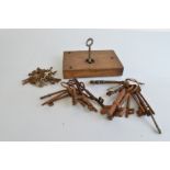 A collection of 19th Century and later keys, and an oak lock with working key