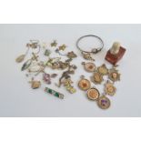 A quantity of silver jewels, including a paste set bar brooch, various sporting medallions, amethyst