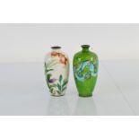 Two Asian white metal and enamel ovoid vases, the cloisonne decoration depicting lily flowers to a