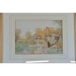 Three early 20th Century watercolours, all of cottages, either surrounded by flowers or river and