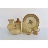 A collection of stoneware, to include stylised leaf decorated charger impressed JA 39cm diameter,