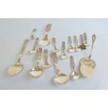 A collection of Norwegian silver commemorative serving spoons, including an enamel example,