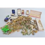 A quantity of costume jewellery, including a pair of tortoise brooches, 9ct gold and crystal drop