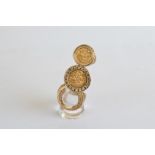 Three 9ct gold rings, two af, one set with a simulated 9ct gold sovereign and paste set stones,