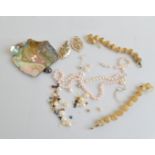 Various pearl and shell beads, and panels