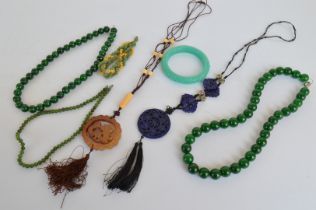 Two stained quartzite simulated spinach jade necklaces, two hardstone Chinese necklaces, and three