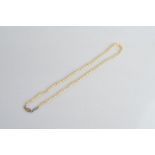 A graduated string of knotted cultured pearls, 7.7mm largest, 3.8mm smallest, with 9ct gold