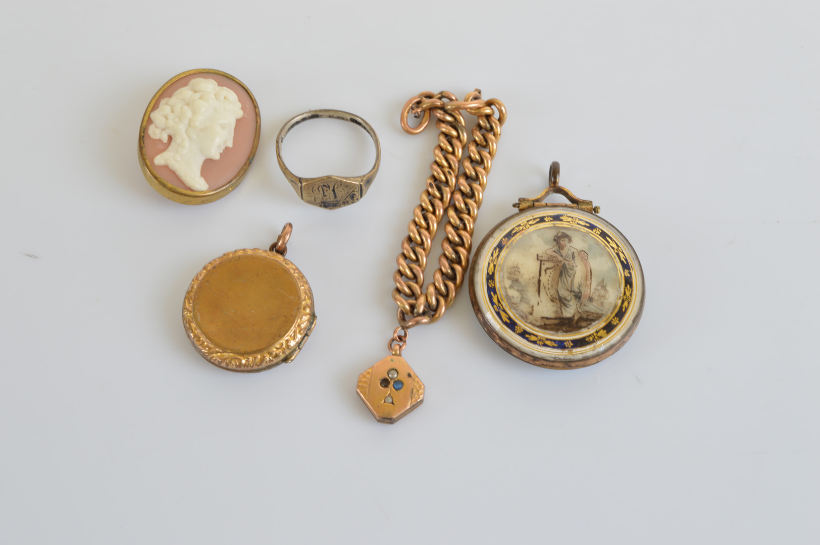 An 18th Century glass and verre eglomise circular locket, with Britannia, with ivory panel of