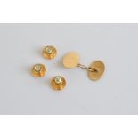 Three 15ct gold enamel and mother of pearl dress studs, 3.9g, and a 9ct gold single cufflink, 2.2g