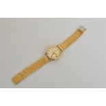 A presentation Omega de Ville 9ct gold gentlemans wristwatch, silvered dial, date window, baton