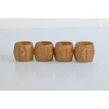 A set of four Robert Thompson Kilburn 'Mouseman' octagonal carved napkin rings, 5cm high x 6cm