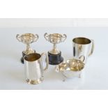A collection of miscellaneous silver, including two christening mugs, a pair of silver putting