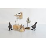 A pair of base metal bronzed bird figures, together with an American Big Sky carved decoy duck,