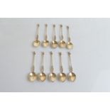 Ten North African white metal teaspoons, all with figural stem and terminal, marked to reverse of