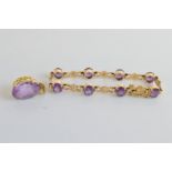 A 9ct gold amethyst bracelet, having hallmarked crossover links set with claw set amethysts together