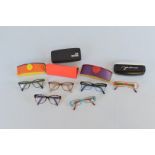 A collection of seven ladies spectacles, all with different frames, Kath Kidston, Heywear, Moschino,