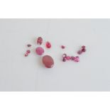 A quantity of loose corundum variety ruby, including cabochons, round cuts and ovals, 7.4ct