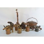 A collection of early 20th Century blow torches, a cast iron road light by Wells Unbreakable, no