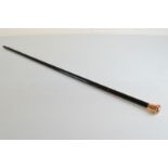 A George V 9ct gold and ebony walking cane, the tapered stem with horn ferrule, monogrammed RW 1926,