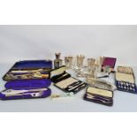 A quantity of cased silver and silver plated flatware, including a silver christening set, knife,