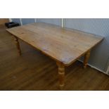 An early 20th Century pine kitchen table, of rectangular form, turned supports, 187cm x 101cm x 73cm