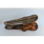A cased violin, circa 1900s with solid back, pine front, terminating in scroll with rosewood