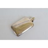 A George V silver rectangular hip flask, with hinged screw off cap, cork inner, dated Birmingham