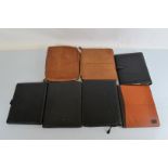 Seven leather folios, including a Filofax example of A4 size, three in tan leather and three others