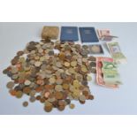 A quantity of British and world loose coinage, including a collection of used paper money, from