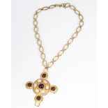 A large Trifari gilt metal and simulated garnet and moonstone cross pendant and chain, marked to