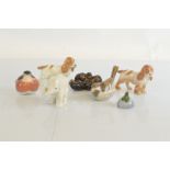 Seven Royal Copenhagen porcelain animal and bird figurines, including a pair of spaniels, 11cm, a
