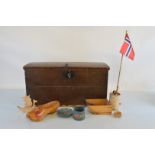 A Norwegian stained pine domed hinged trunk, 65cm wide x 32cm deep x 34cm high containing various