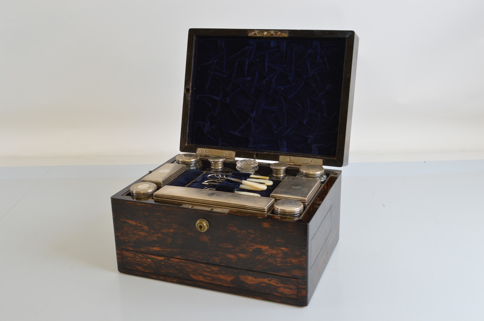 A 19th Century coromandel gentleman's dressing table box, with silver lidded contents hallmarked