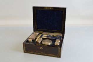 A 19th Century coromandel dressing table box, wit silver lidded contents hallmarked London 1865