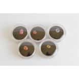 Five corundum variety loose gem stones, comprising oval yellow sapphire 0.5ct, paoparadscha 0.5ct,
