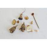 A collection of miscellaneous jewellery, including a garnet and yellow metal set stick pin, base