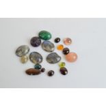 A collection of labradorite, malachite, carved cabochon amethyst and other items