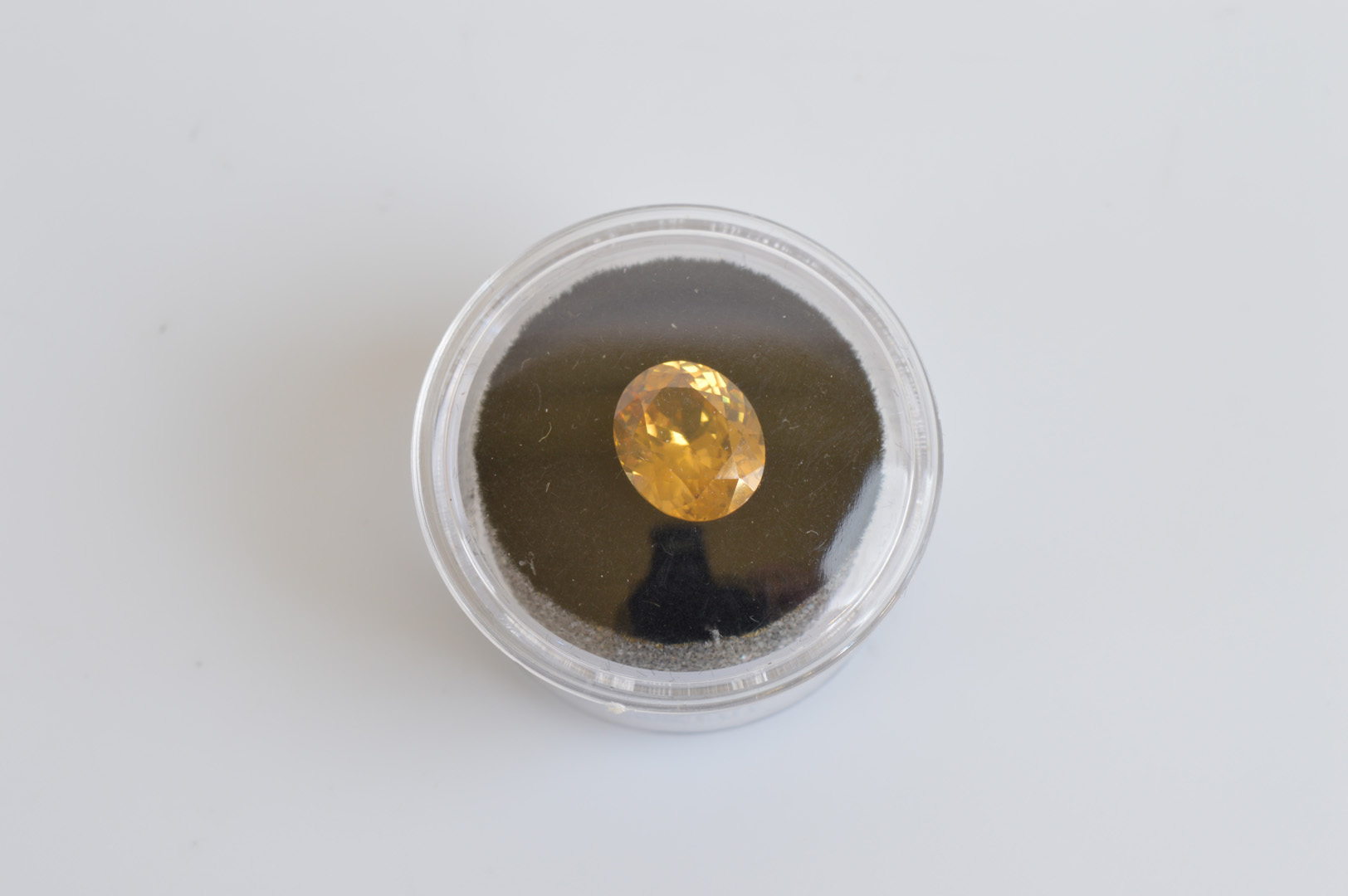 An oval mixed cut zircon, the golden colour 4.38ct