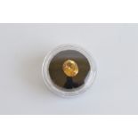 An oval mixed cut zircon, the golden colour 4.38ct