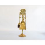 A brass fire companion set, titled A Welcome Guest with John Peel handle accoutrements, 47cm high