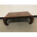 A mid 20th century Chinese hardwood coffee table, 97cm wide