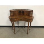 An Edwardian satinwood and painted kidney shaped lady's desk, in the Sheraton revival style, 92cm