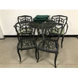 A modern green painted aluminium five piece garden table and chairs set