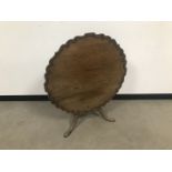 A George III mahogany wine table, AF, the pie crust rim tilt top 84cm diameter, on a cut down tripod